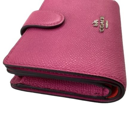  COACH コーチ レディース ２つ折り財布 ショッキングピンク