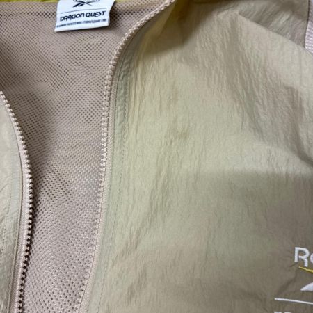 REEBOK リーボック ジャケット ナイロンジャケット SIZE XL ドラゴンクエスト 40周年 RB00160 ベージュ系 x イエロー x ホワイト