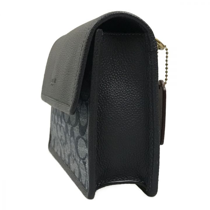 コーチターナーフラップクロスボディシグネチャーシャンブレーデニム