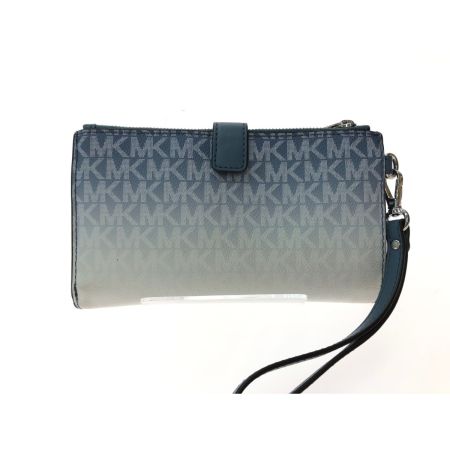  MICHAEL KORS マイケルコース ユニセックス 二つ折り長財布 トラベル ジェットセット シグネチャー ブルー