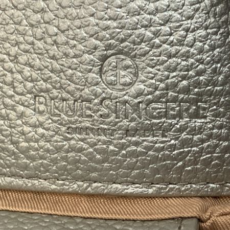  BLUESINCERE ブルー シンシア 本革 スリム長財布 タッセル付き Lassel ラッセル メタリック シルバー